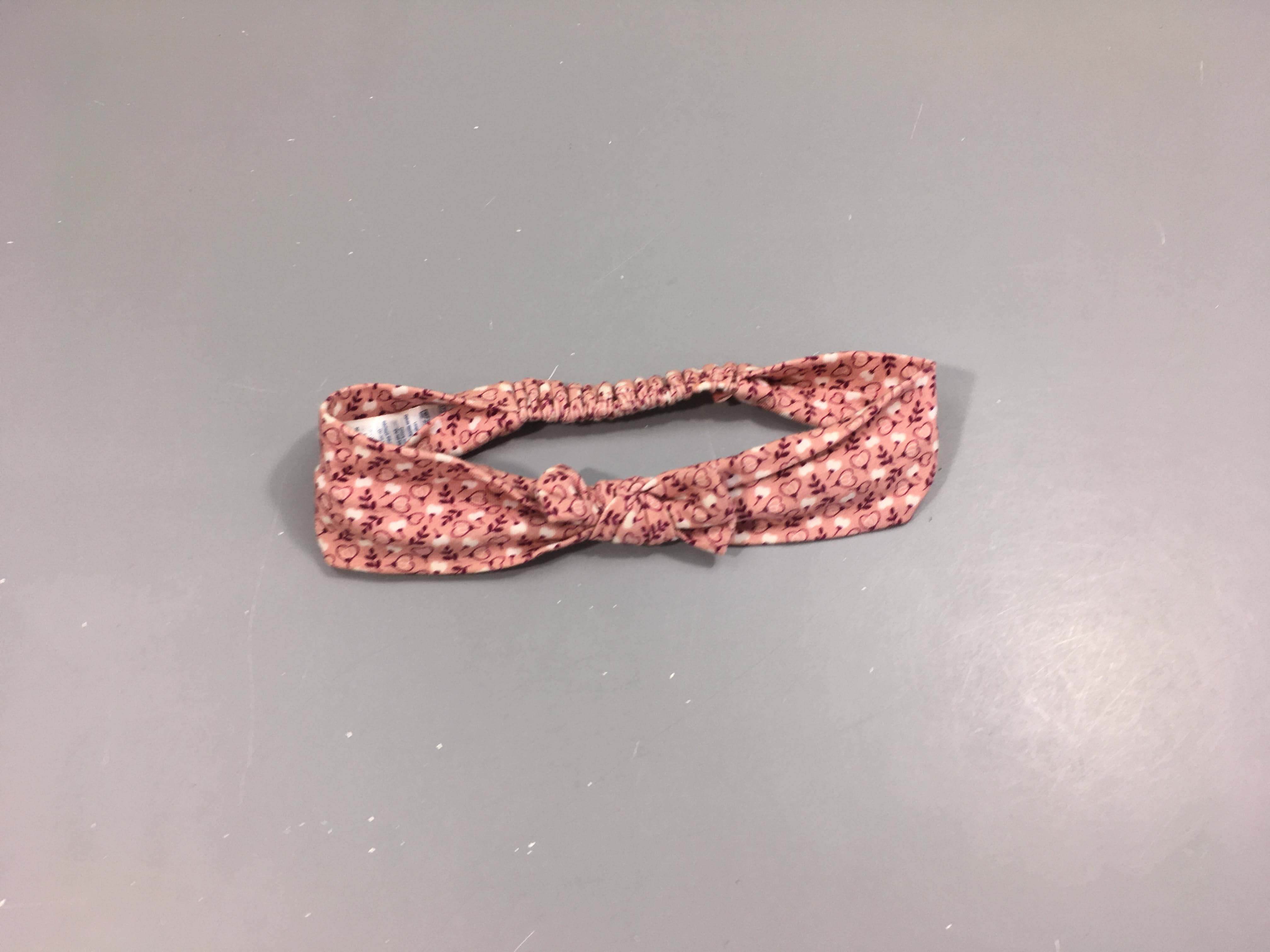 Bandeau rose élastique arrière motifs blancs