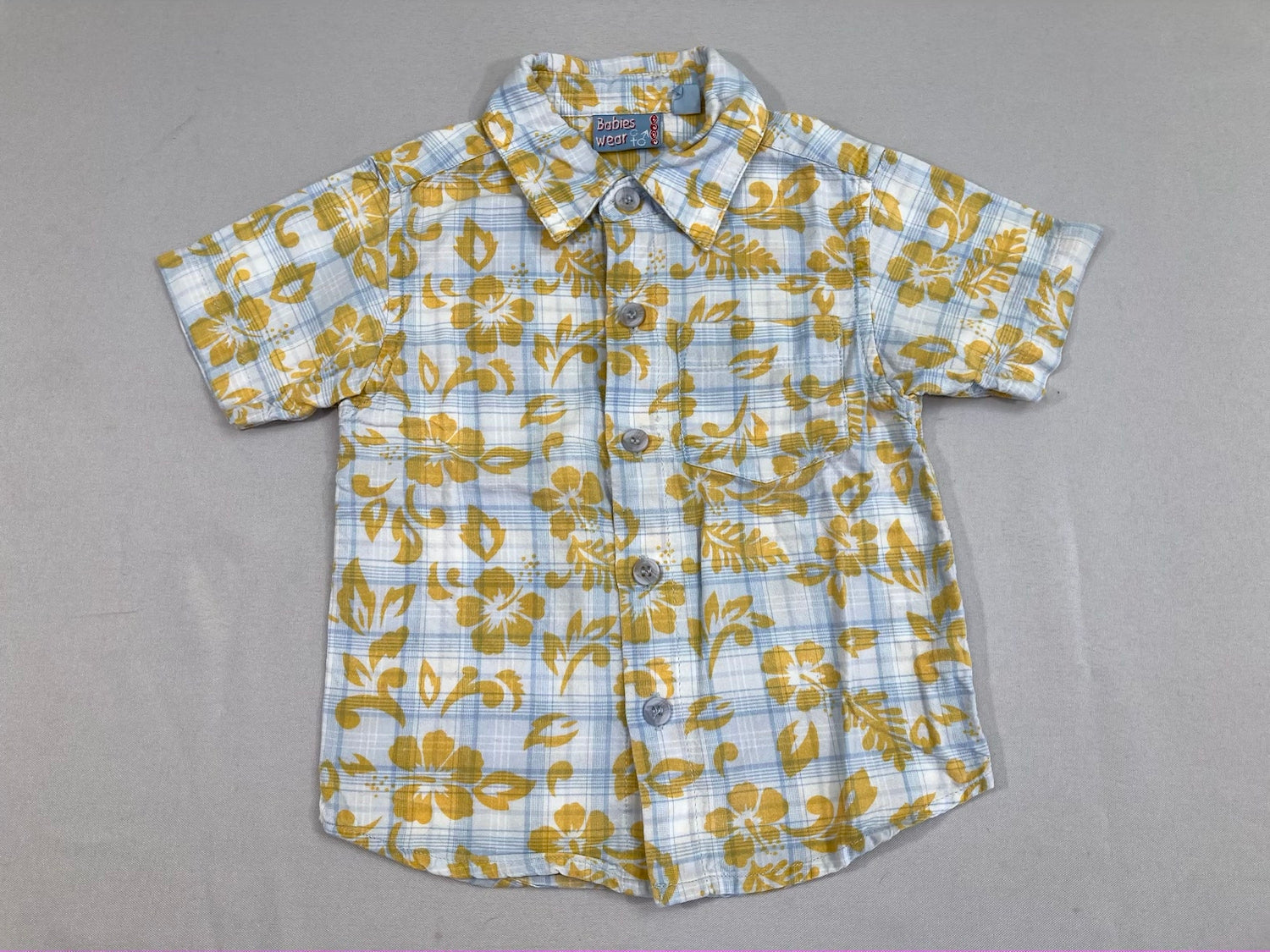 Chemise m.c bleu clair carreaux feurs jaunes