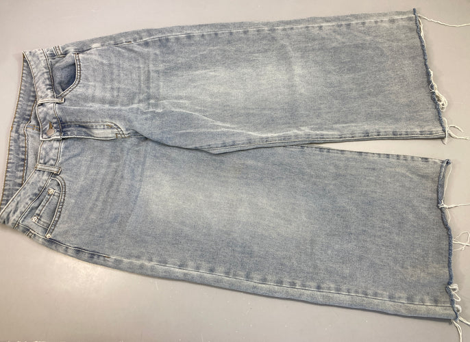 Jeans taille basse style baggy effet effiloché bas, moins cher chez Petit Kiwi