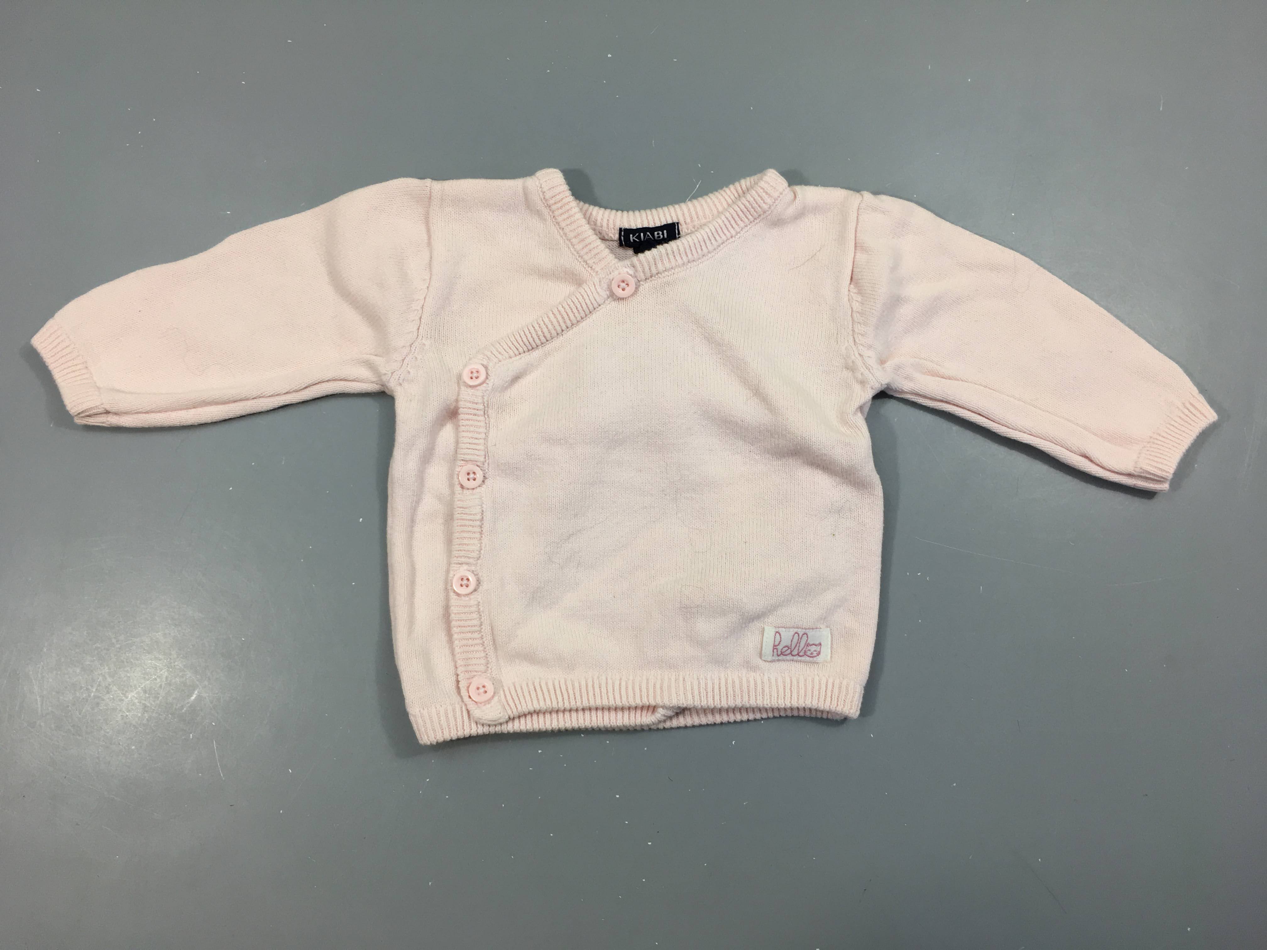 Gilet cache-coeur rose pâle, légèrement bouloché