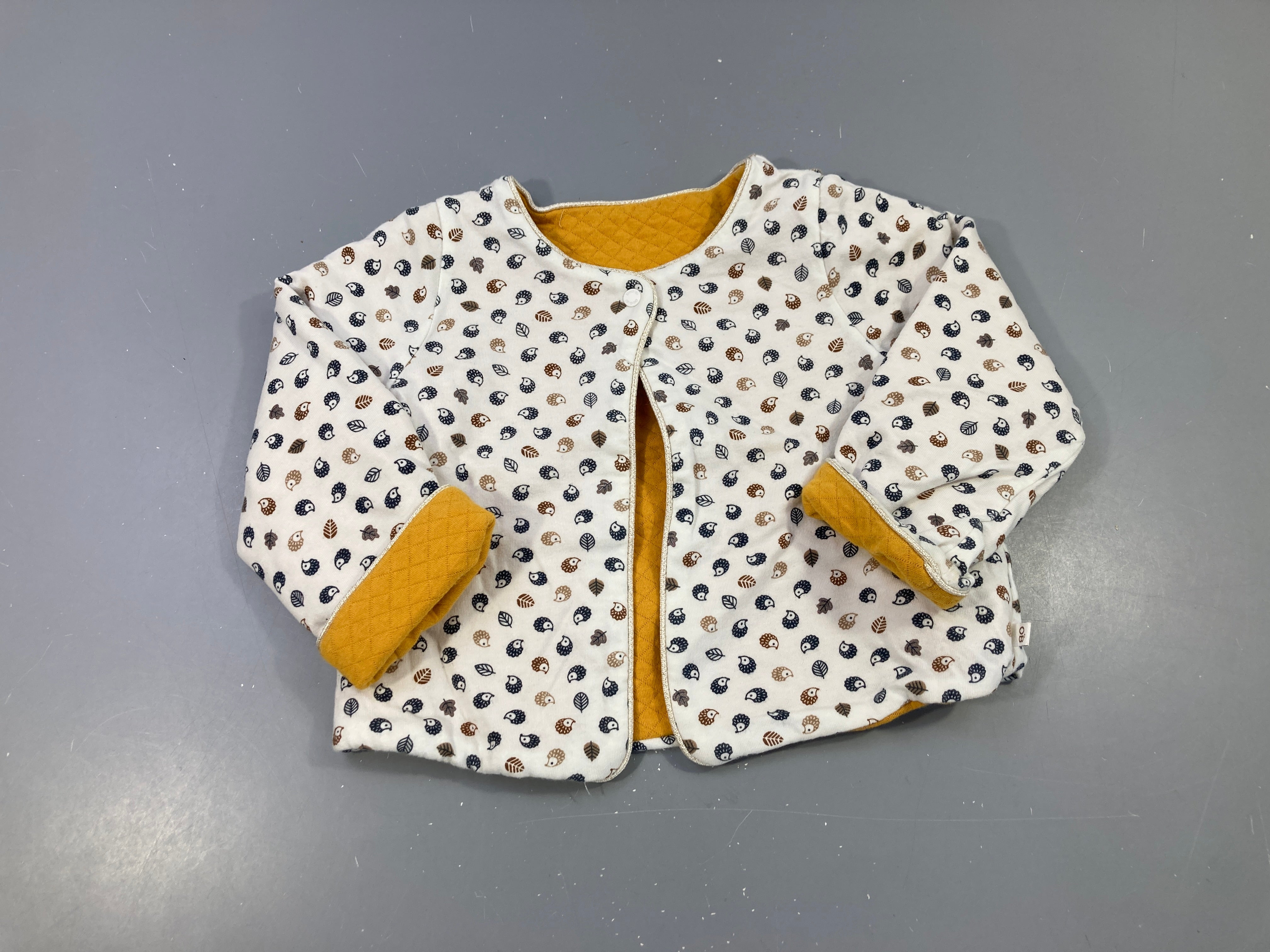 Gilet molleton réversible écru hérissons/jaune