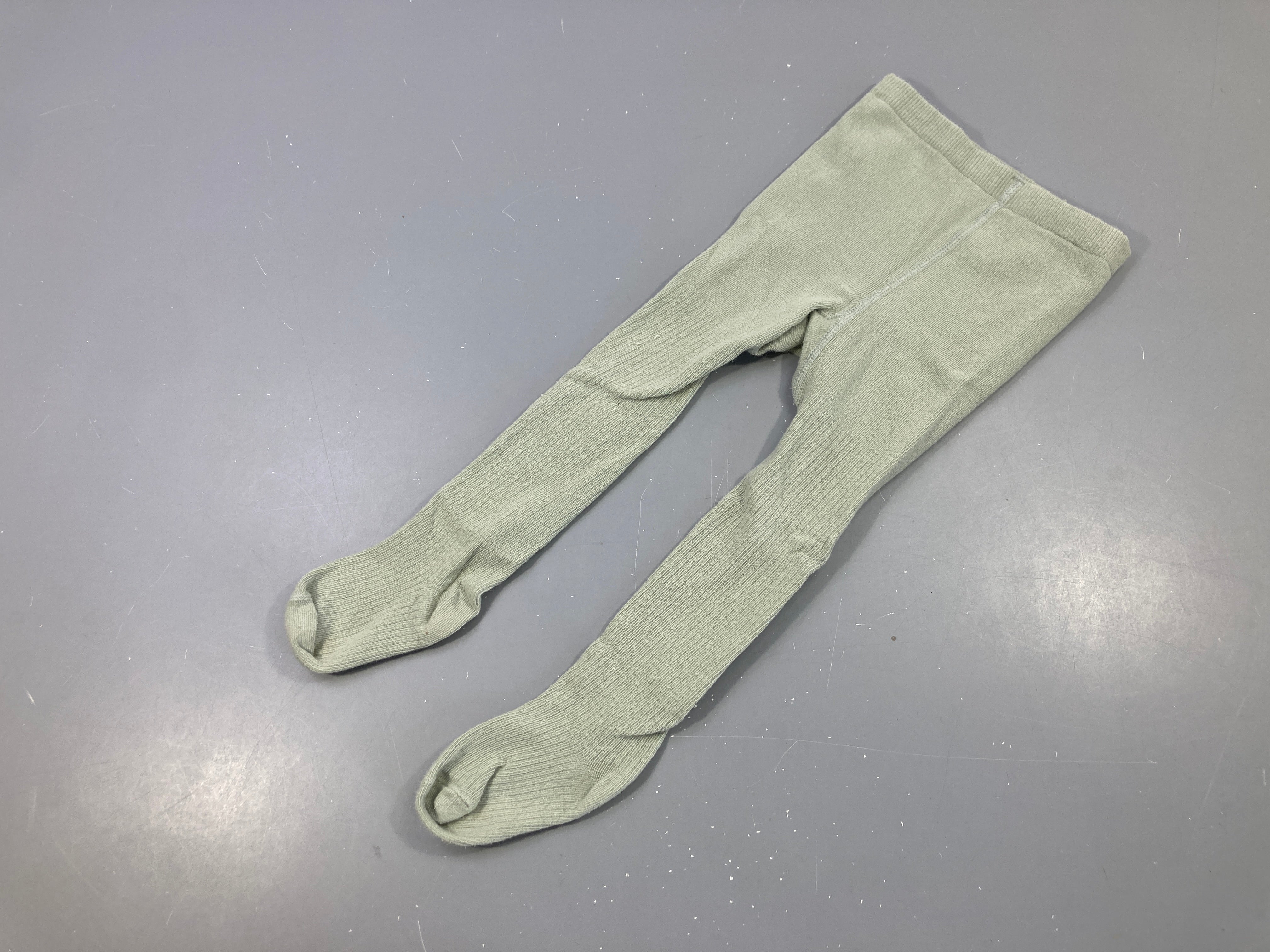 Collants verts côtelés, boulochés