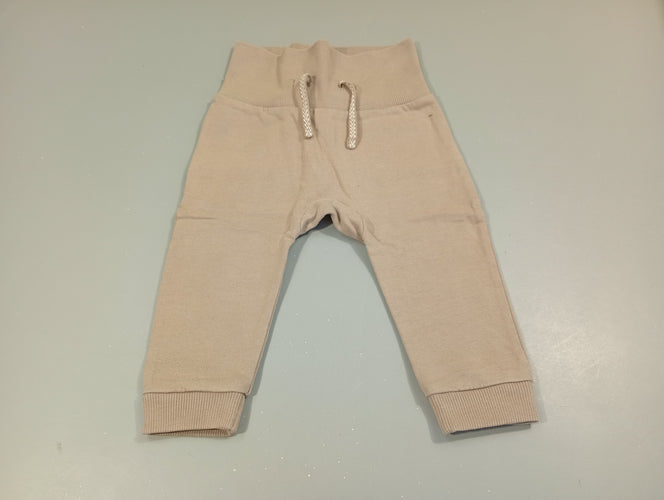 Pantalon molleton gris , taille et chevilles élastiques, moins cher chez Petit Kiwi