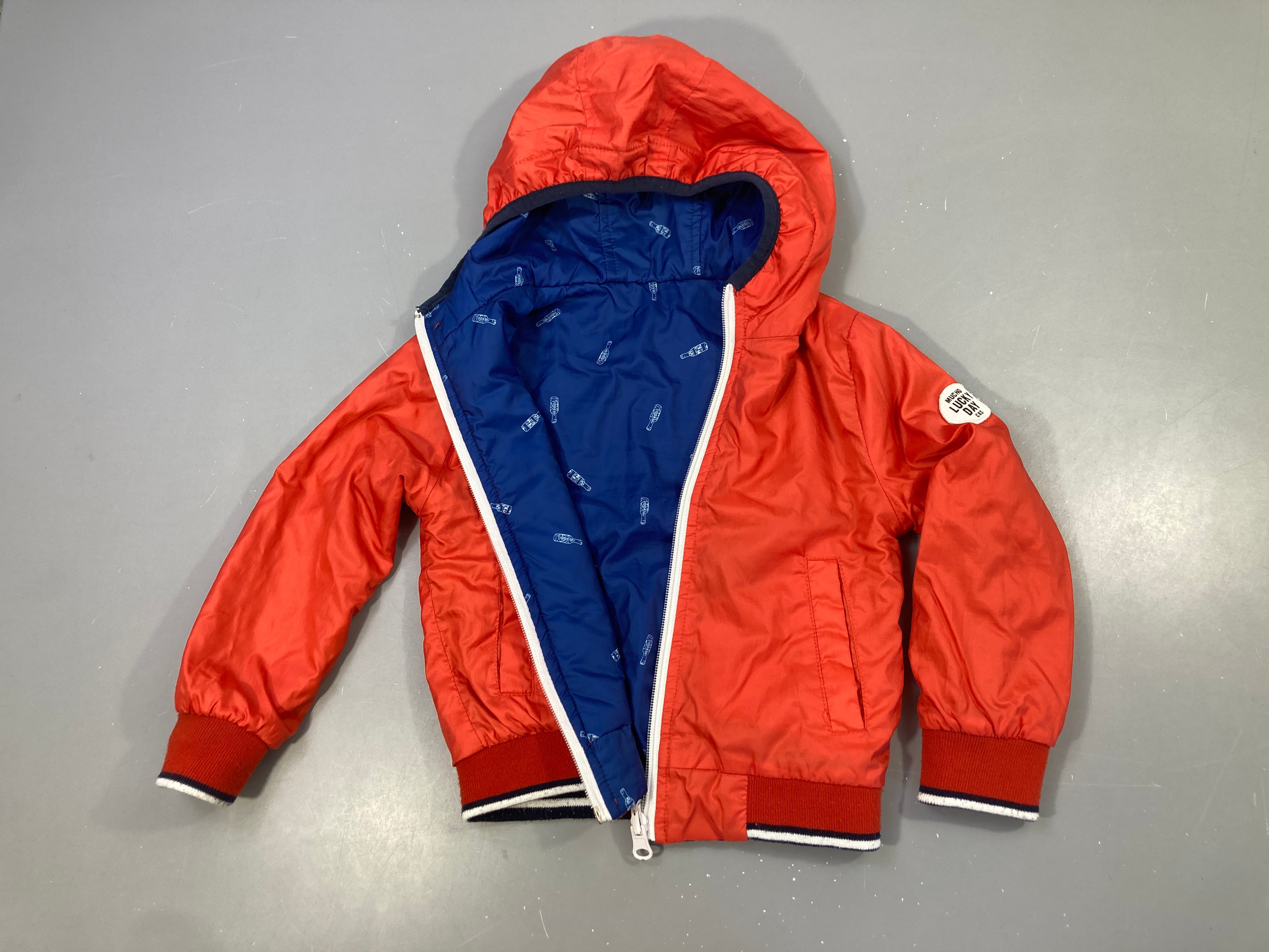 Veste mi-saison réversible à capuche orange/bleu bouteilles