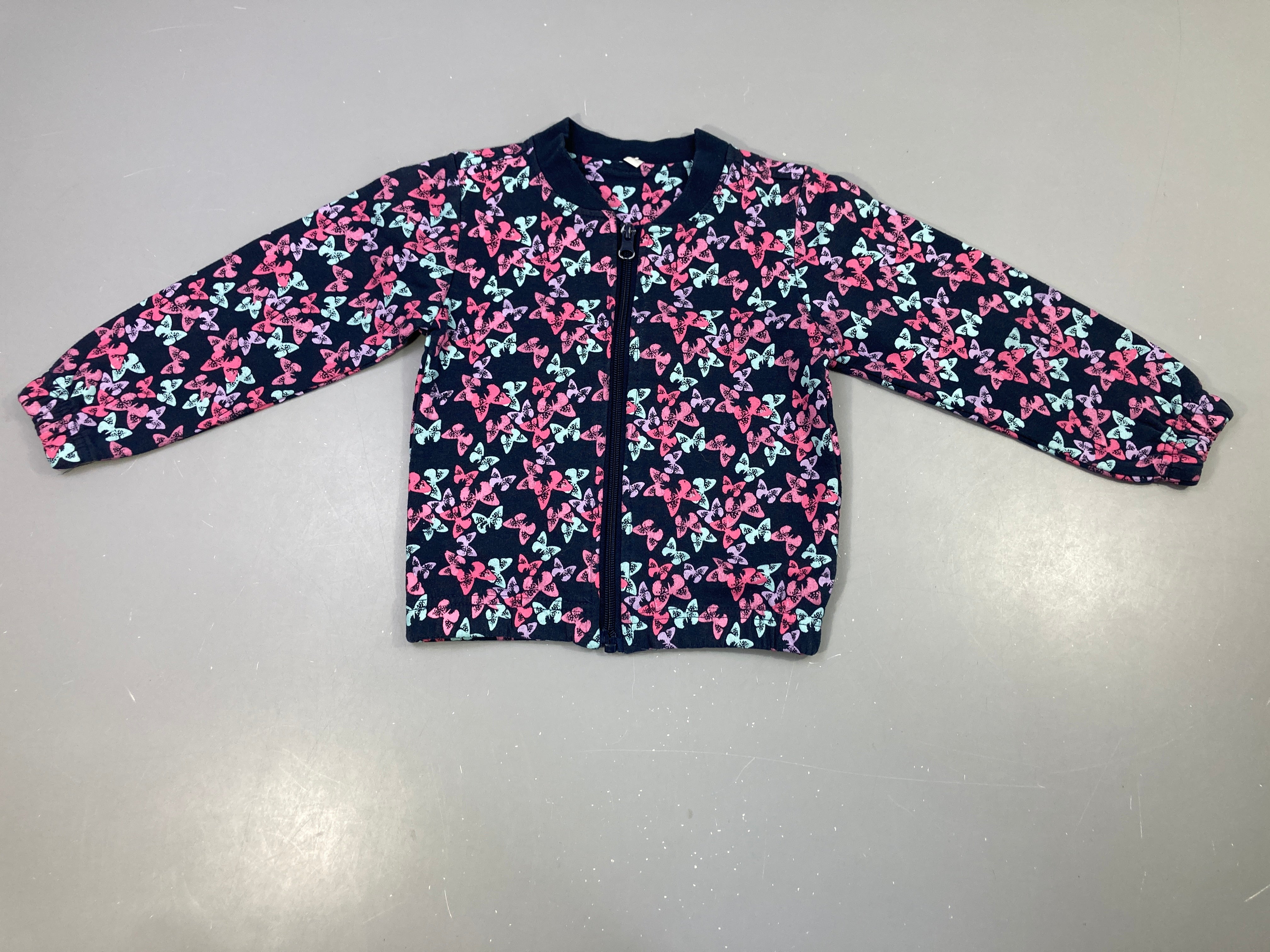 Sweat zippé bleu marine papillons, légèrement bouloché
