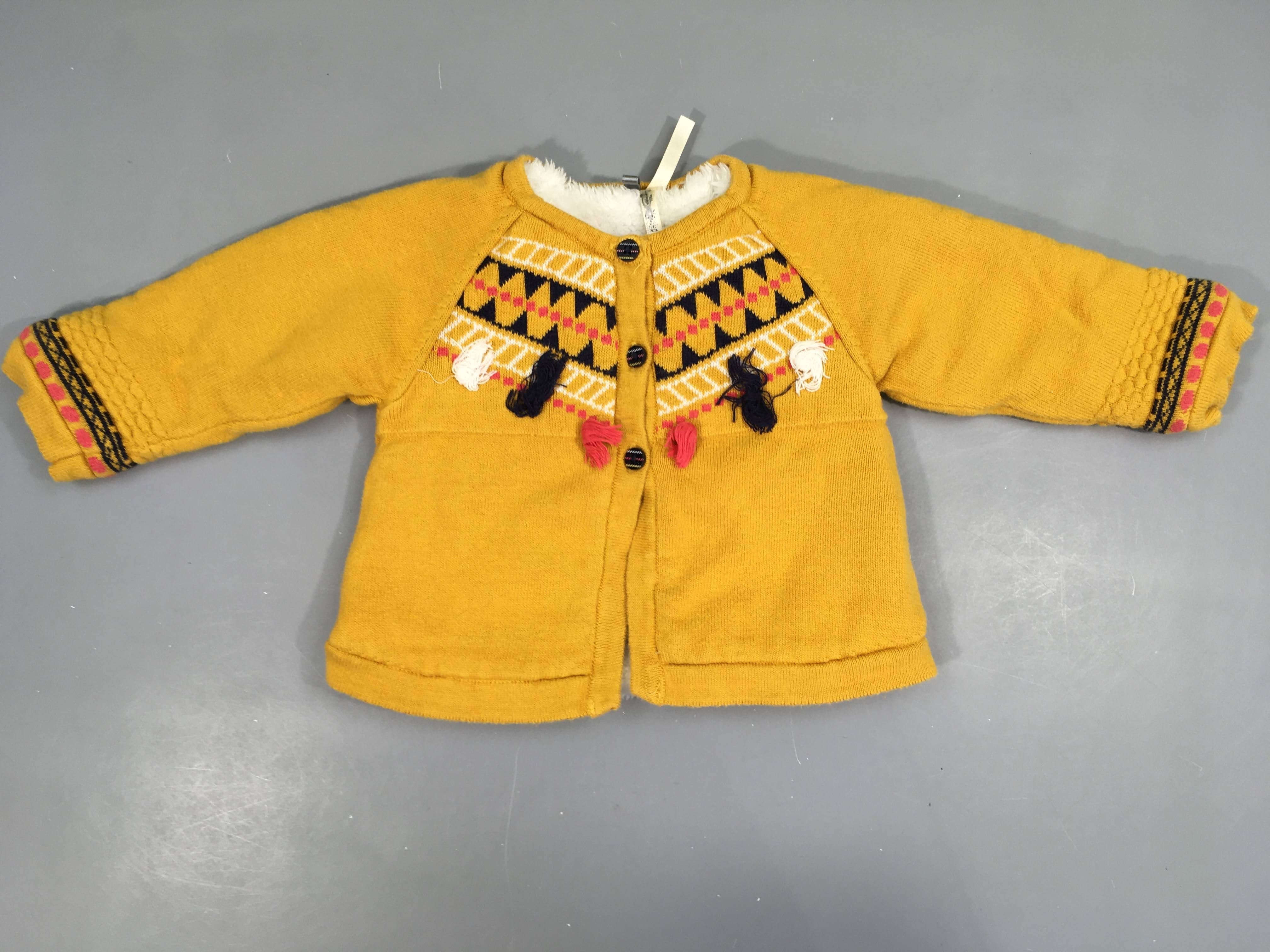 Gilet jaune floches doublé velours, très légèrement bouloché