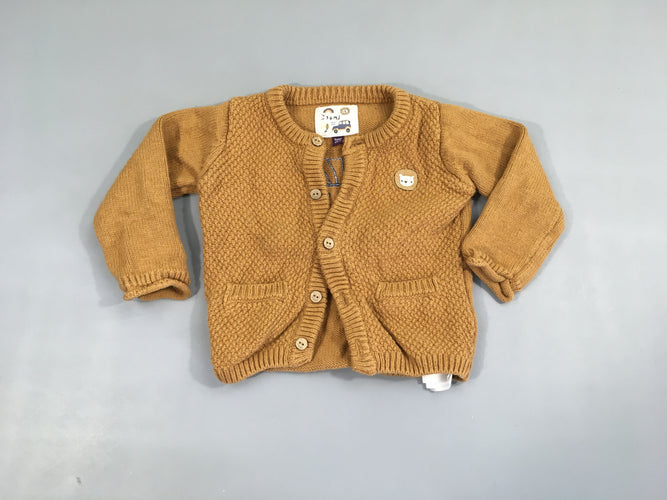 Gilet ocre lion, légèrement bouloché, moins cher chez Petit Kiwi