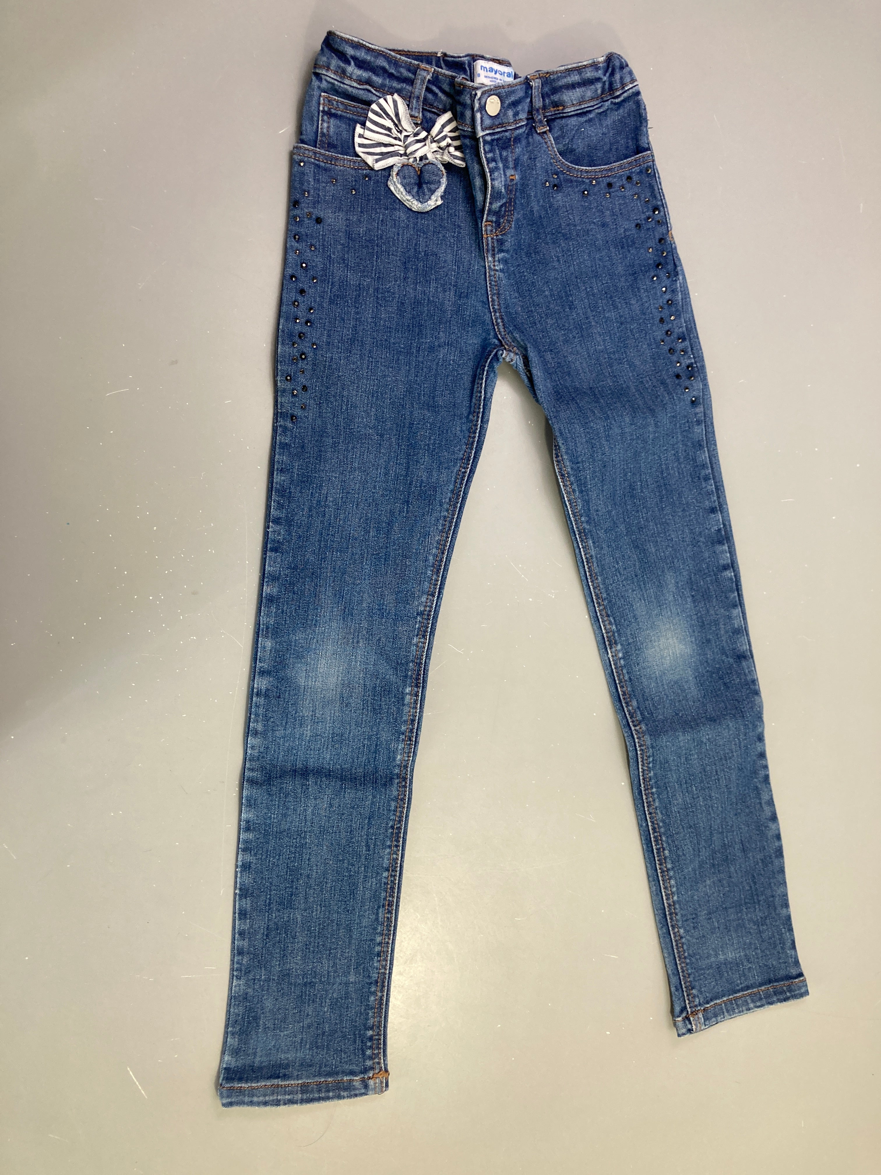 Jean skinny bleu nœud strass