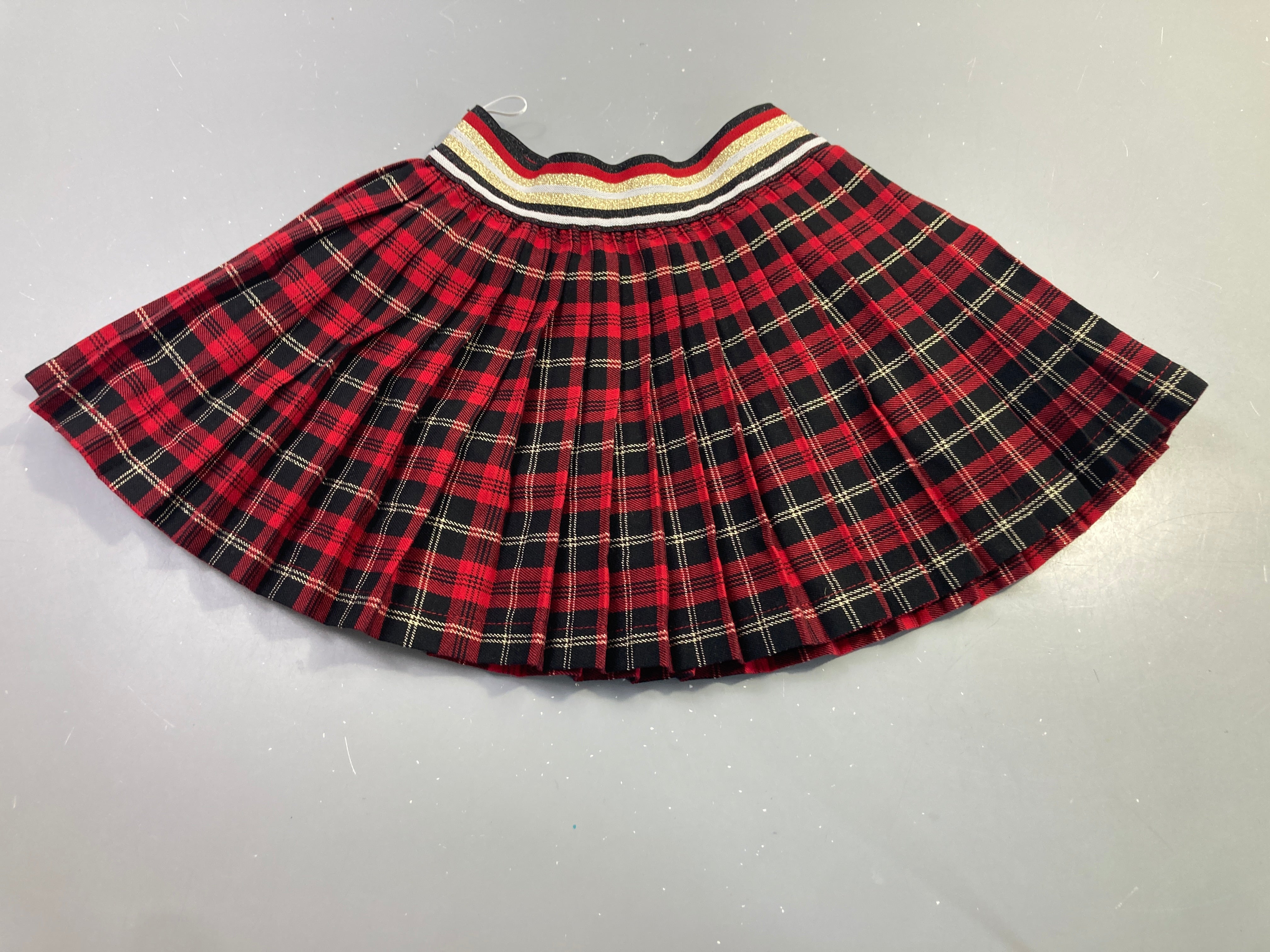 Jupe écossaise rouge plissée