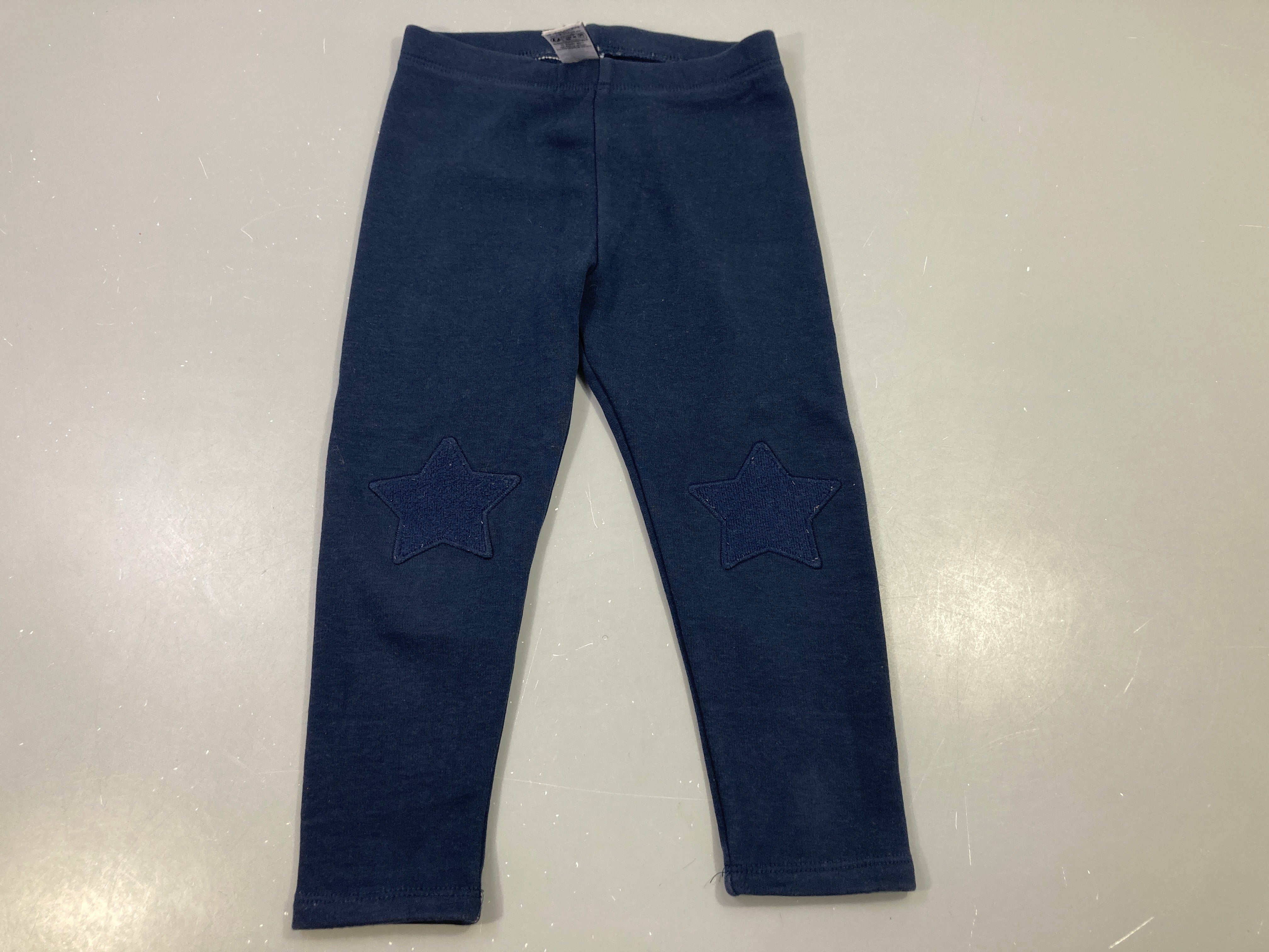 Legging bleu foncé, étoile sur les genoux