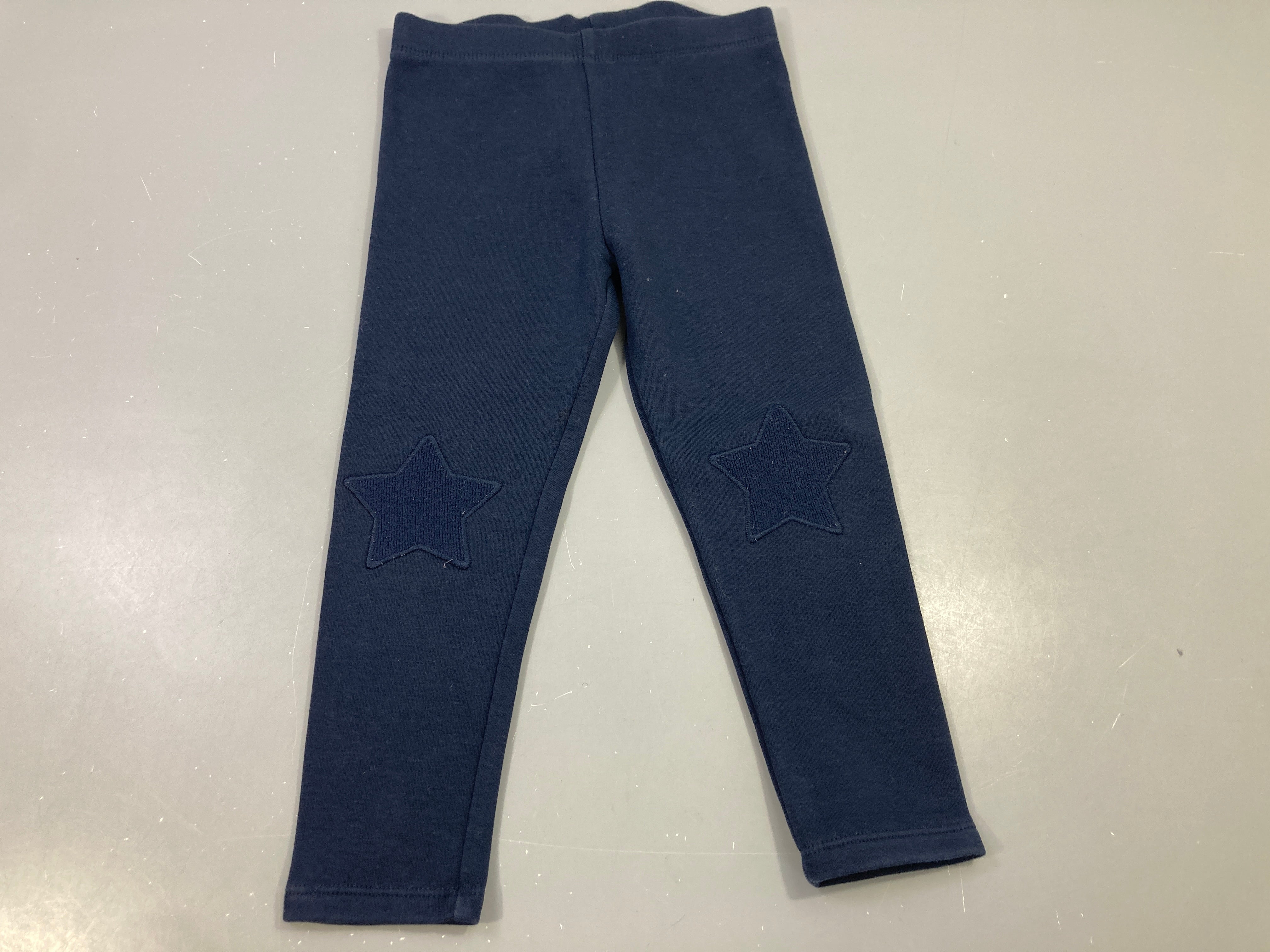 Legging bleu foncé, étoile sur les genoux