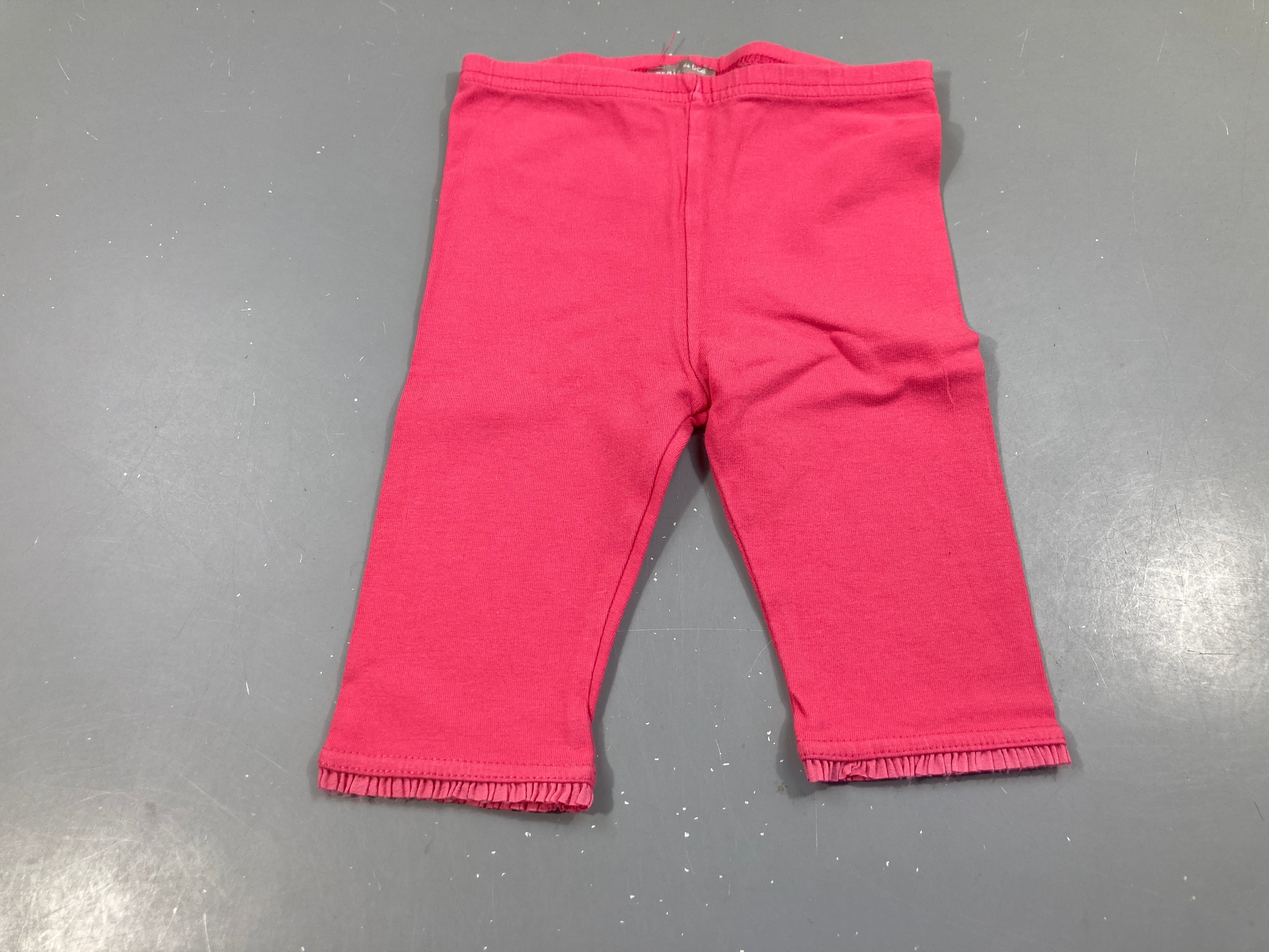Legging 3/4 rose bas froufrous, un peu bouloché