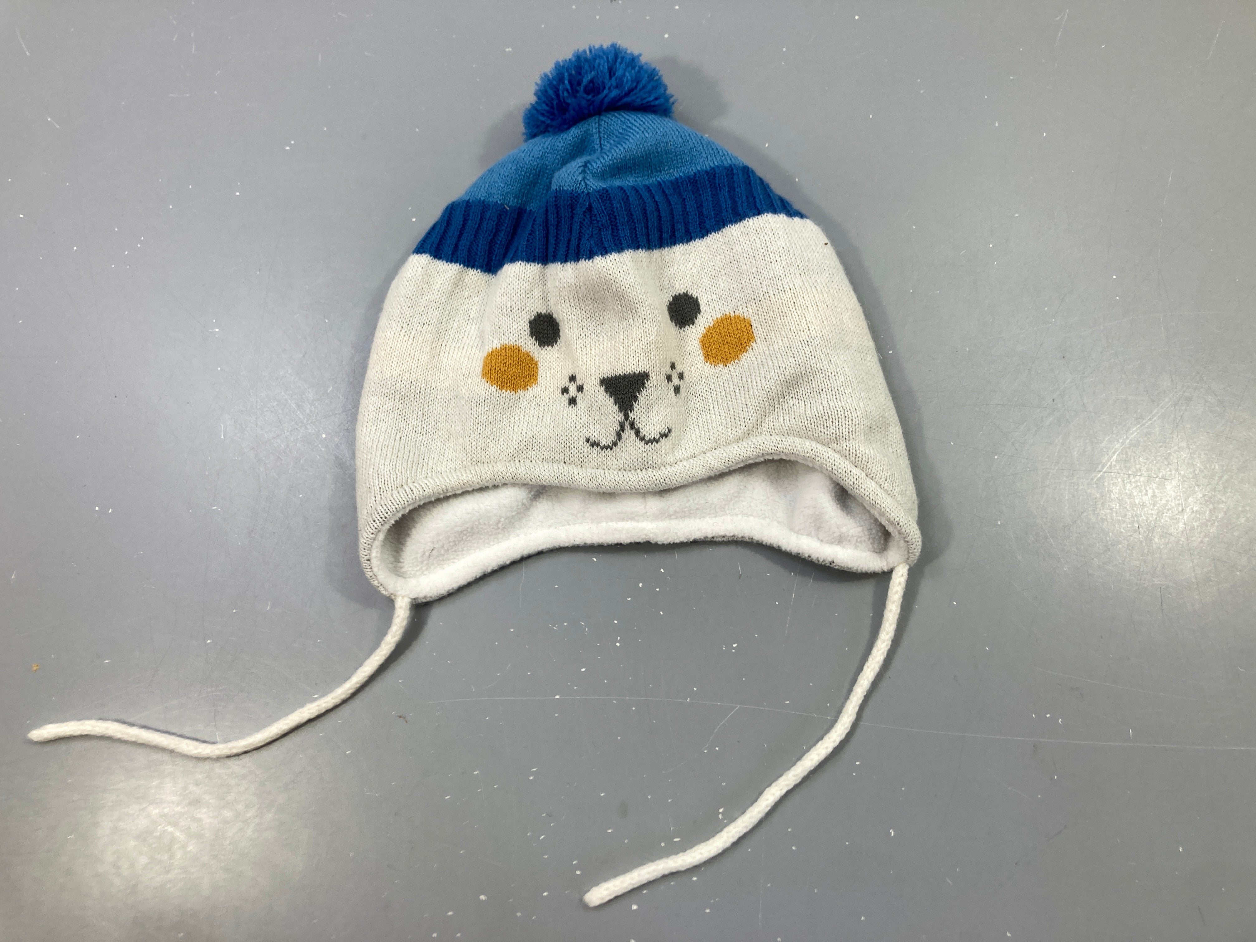 Bonnet péruvien beige/bleu, pompon bleu, oreilles rayées, doublure polaire, cordons à nouer 48/49cm