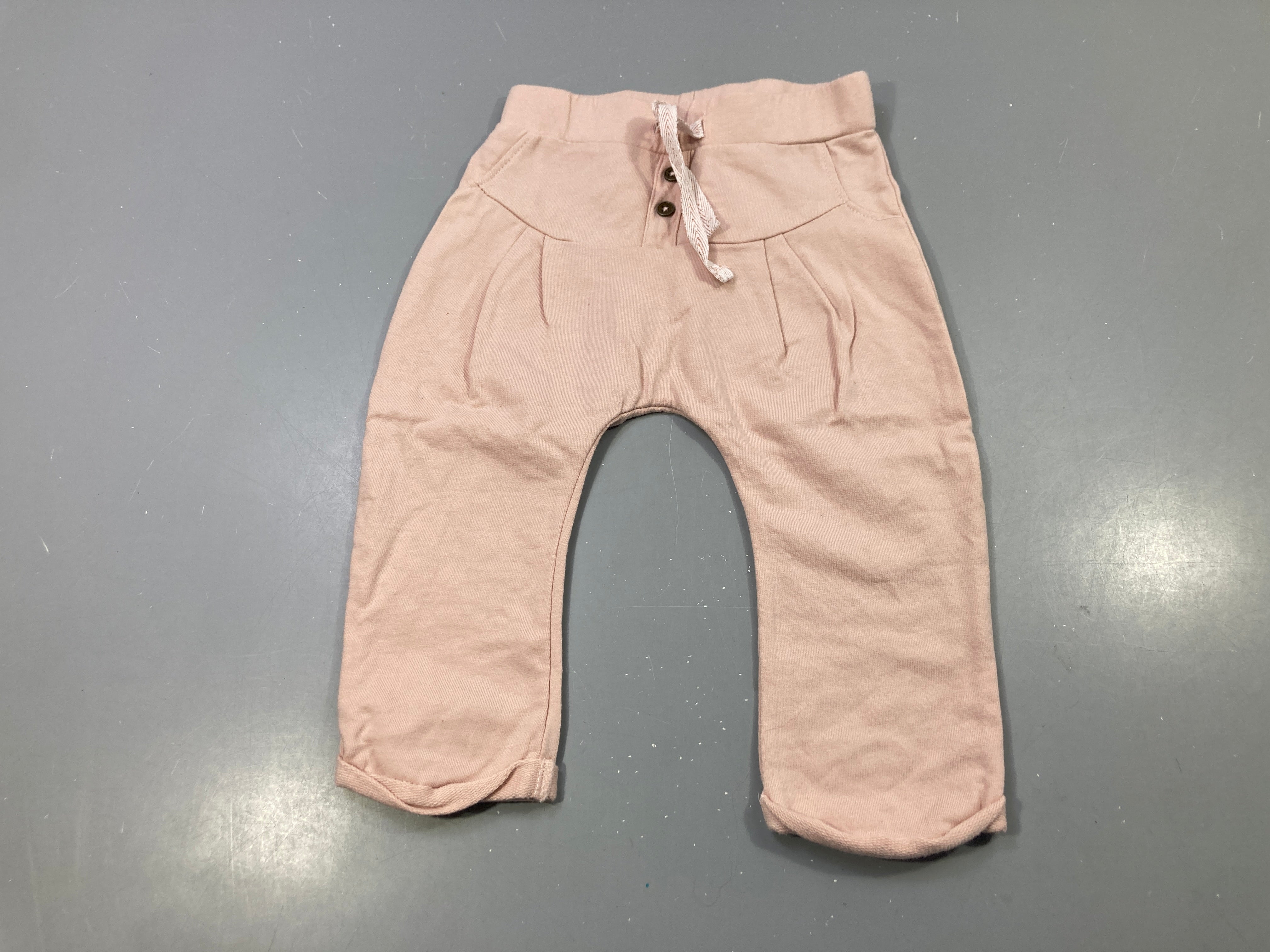 Pantalon molleton rose pâle boutonné poches, cordon