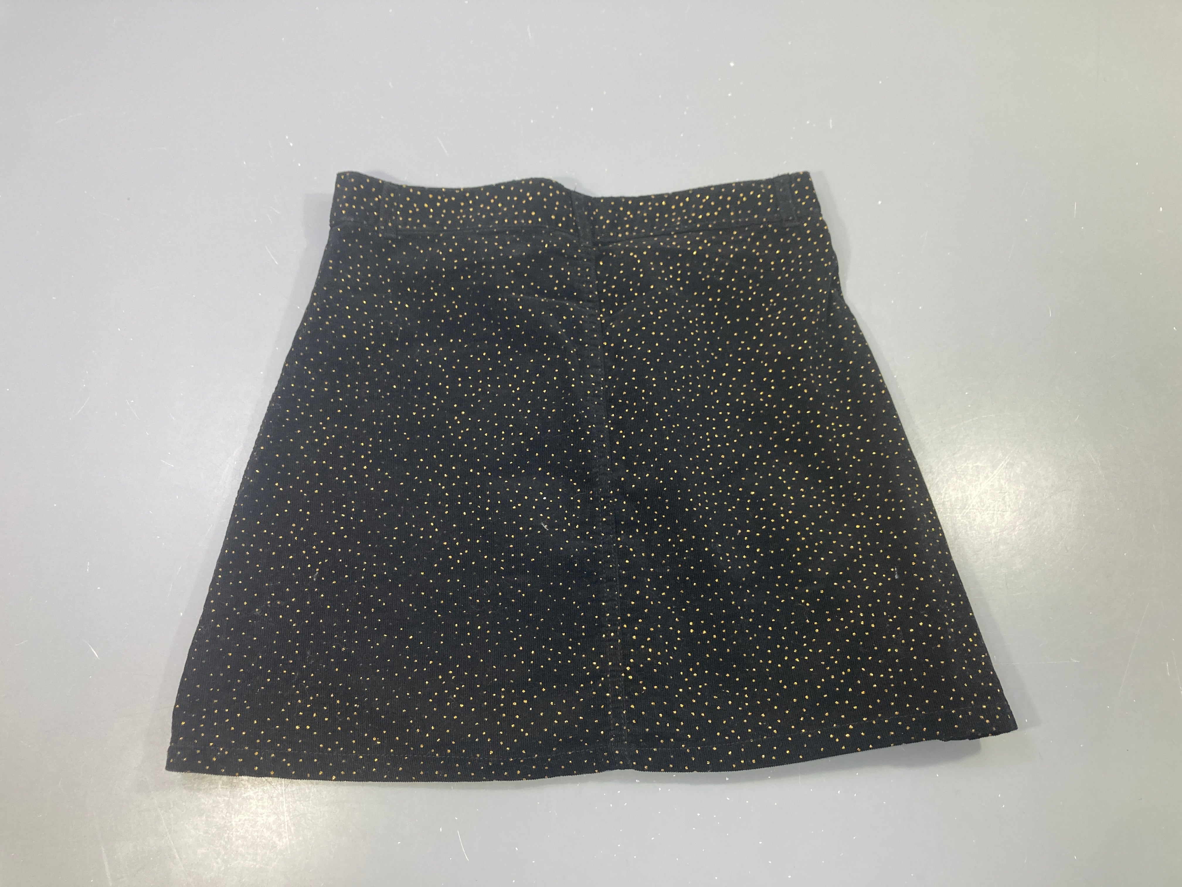 Jupe en velours noir à pois dorés