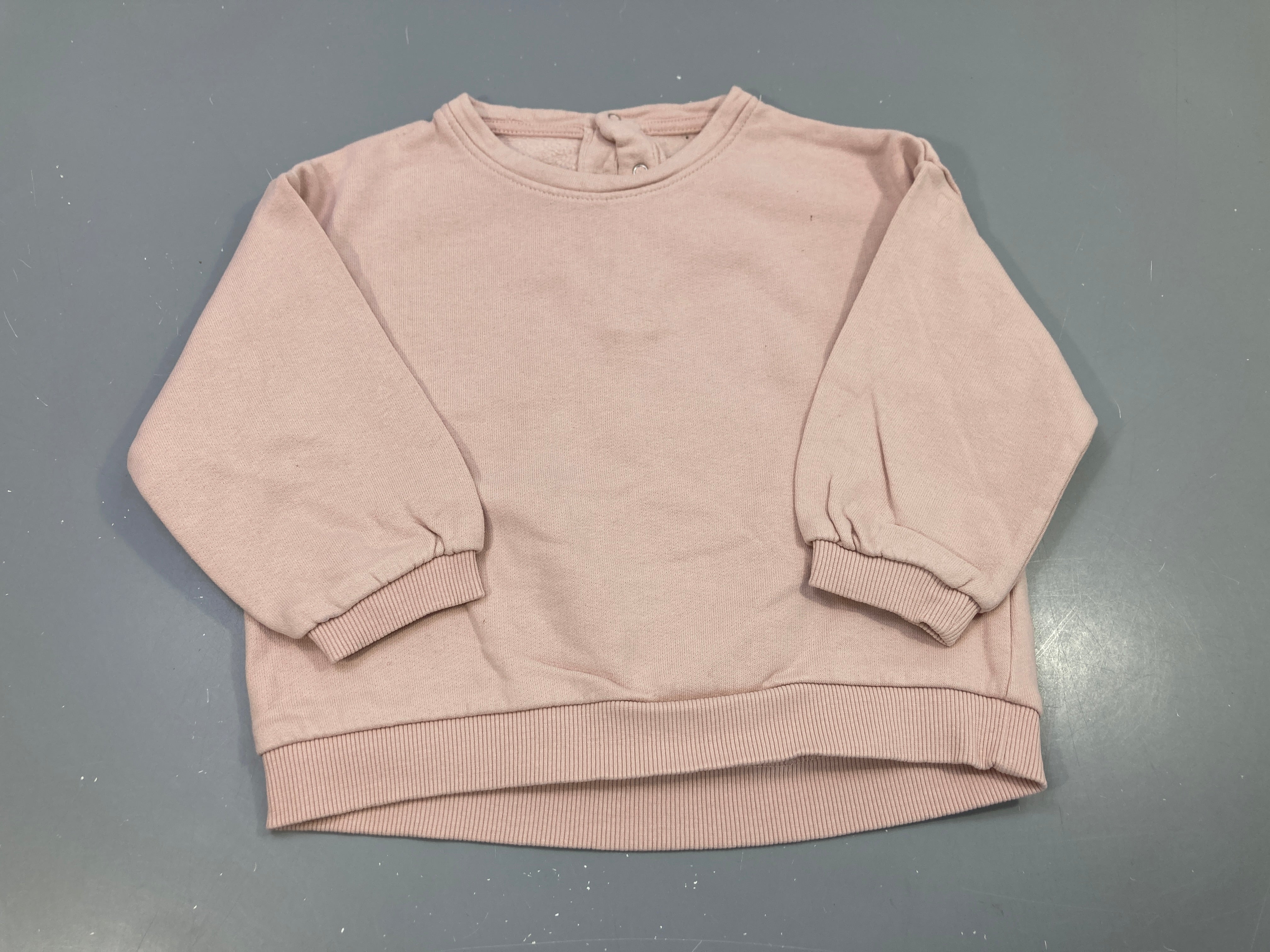Sweat rose uni boutonné dos