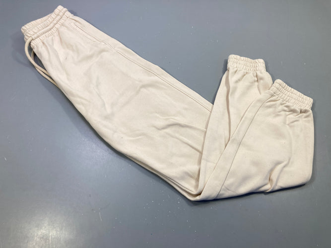 Pantalon jogging beige, taille et chevilles élastiques .  Légèrement bouloché., moins cher chez Petit Kiwi