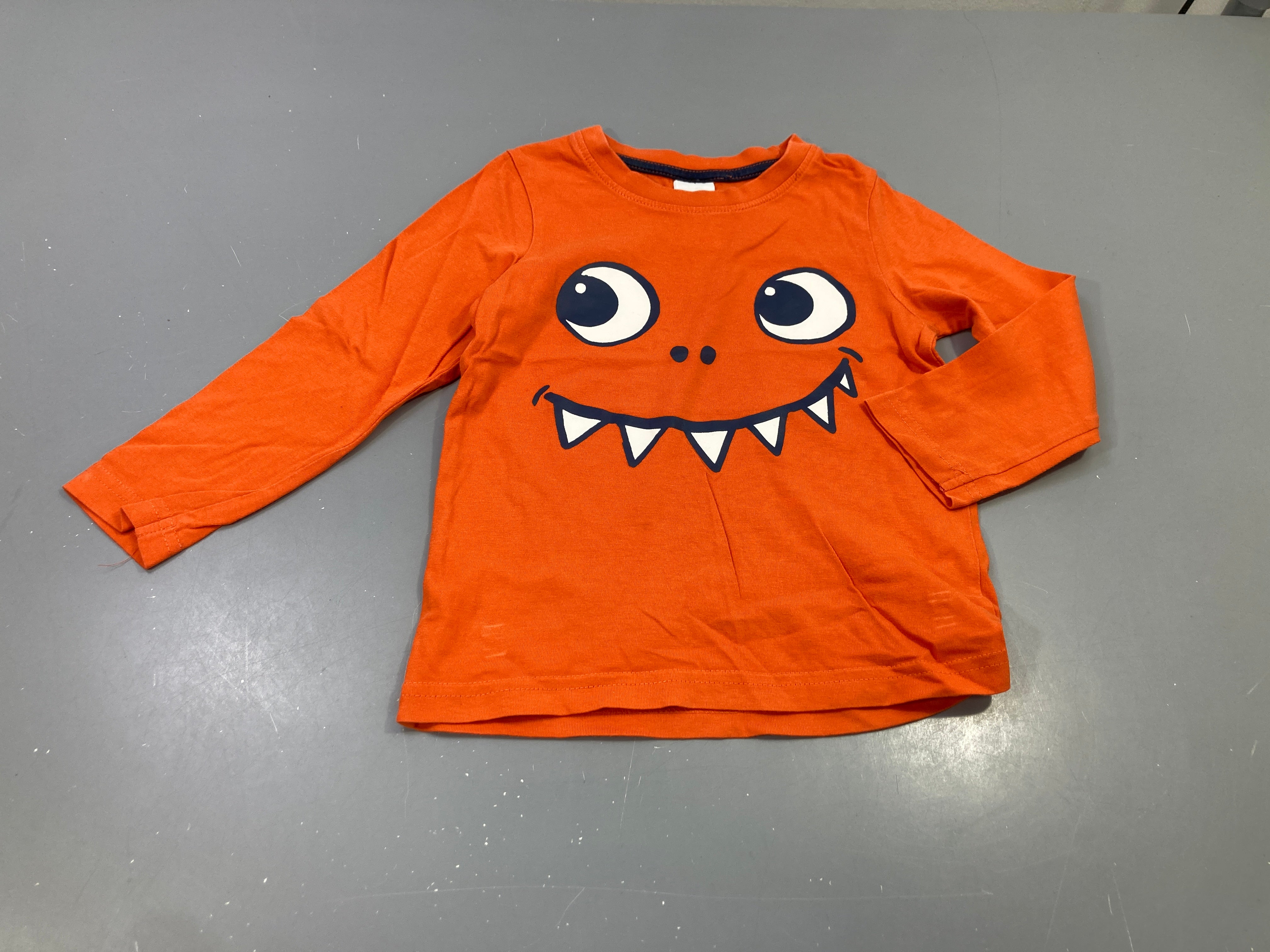 T-shirt m.l orange , tête de monstre