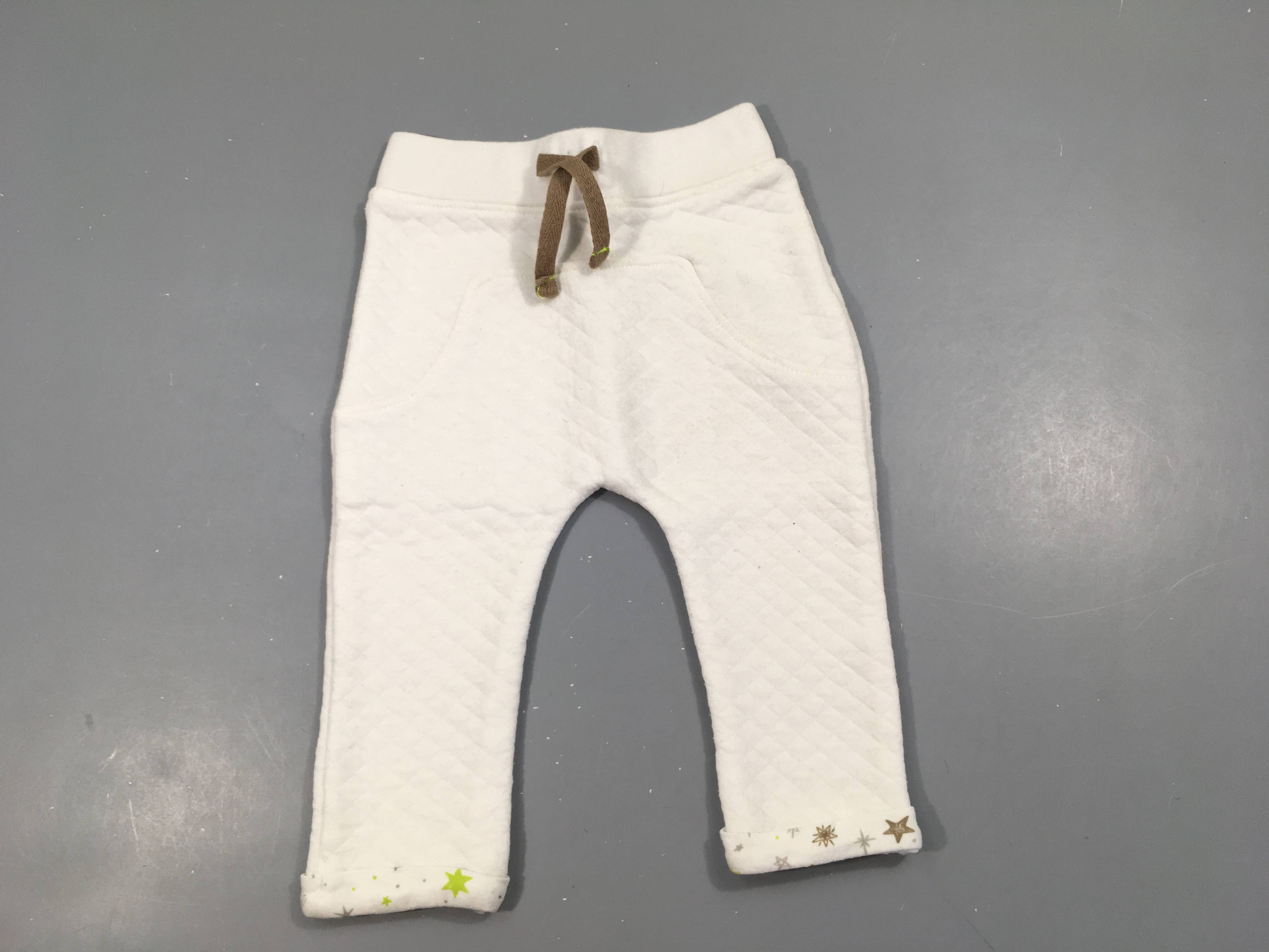 Pantalon molleton blanc blanc revers étoiles, légèrement bouloché