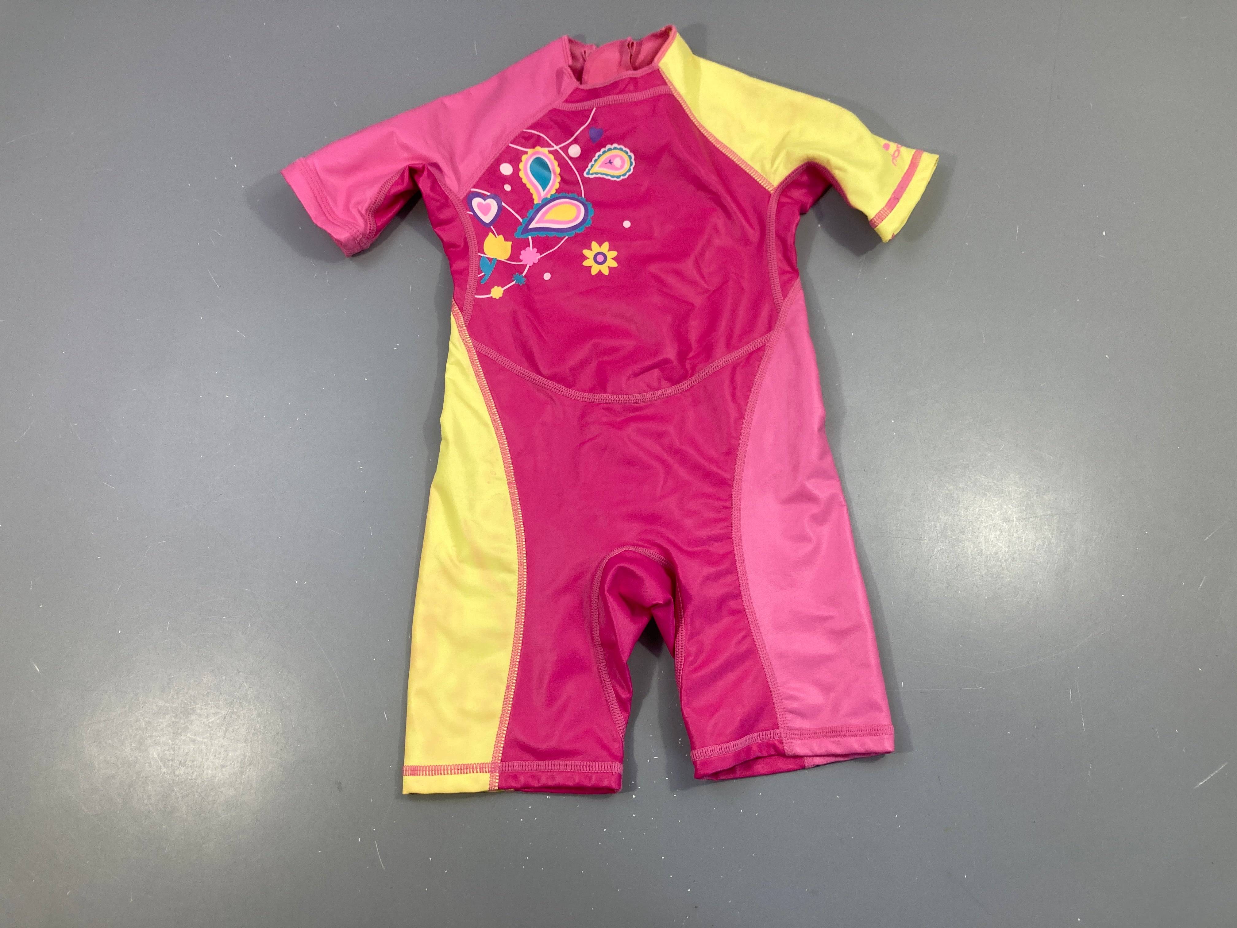 Combi anti-froid anti-uv rose/jaune nabaji