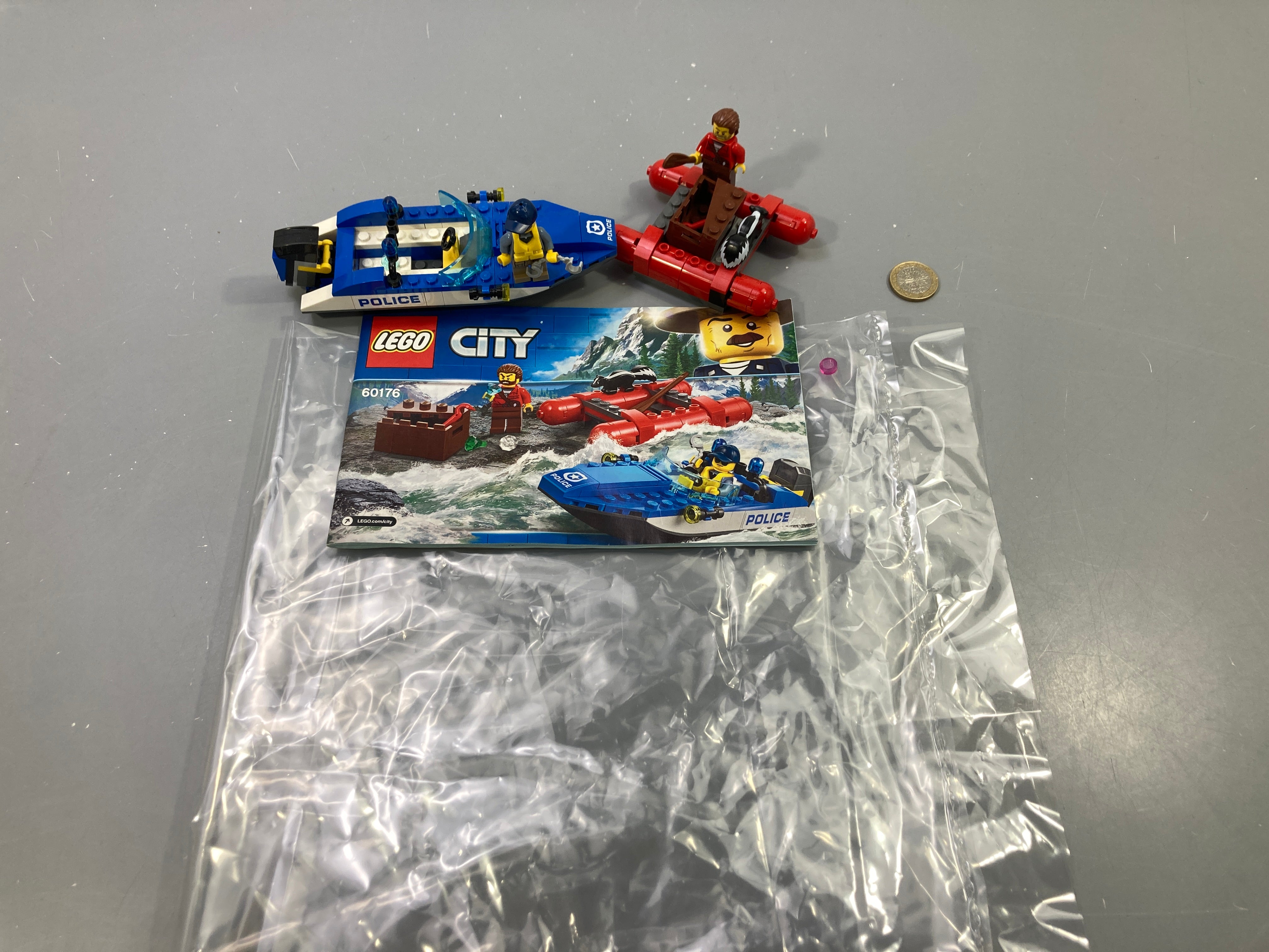 Lego City 60176 police bateau bleu et radeau rouge, figurines, avec notice Vendu en l'état tel que sur la photo
