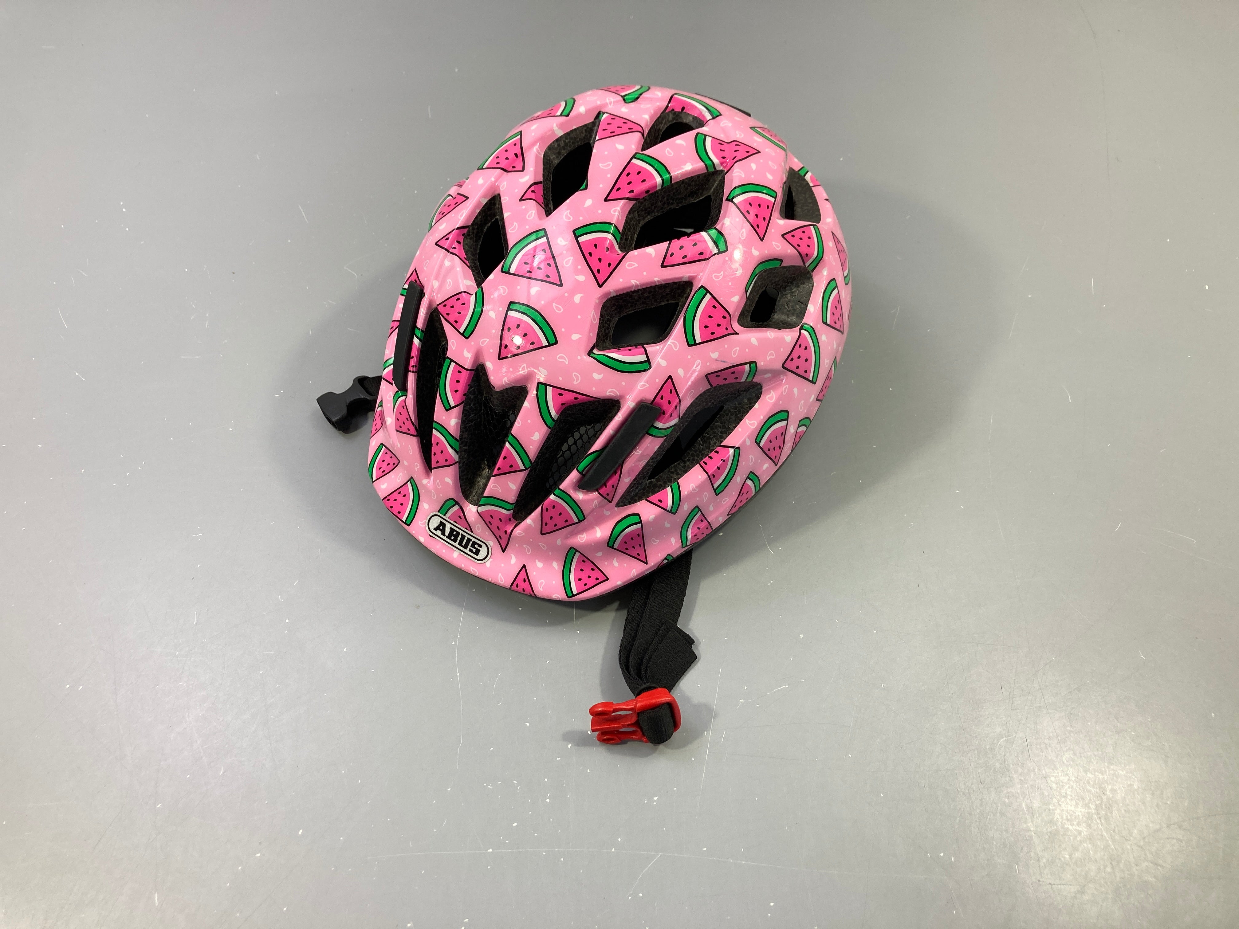 Casque de vélo Abus rose, motifs pastèques 50-55cm