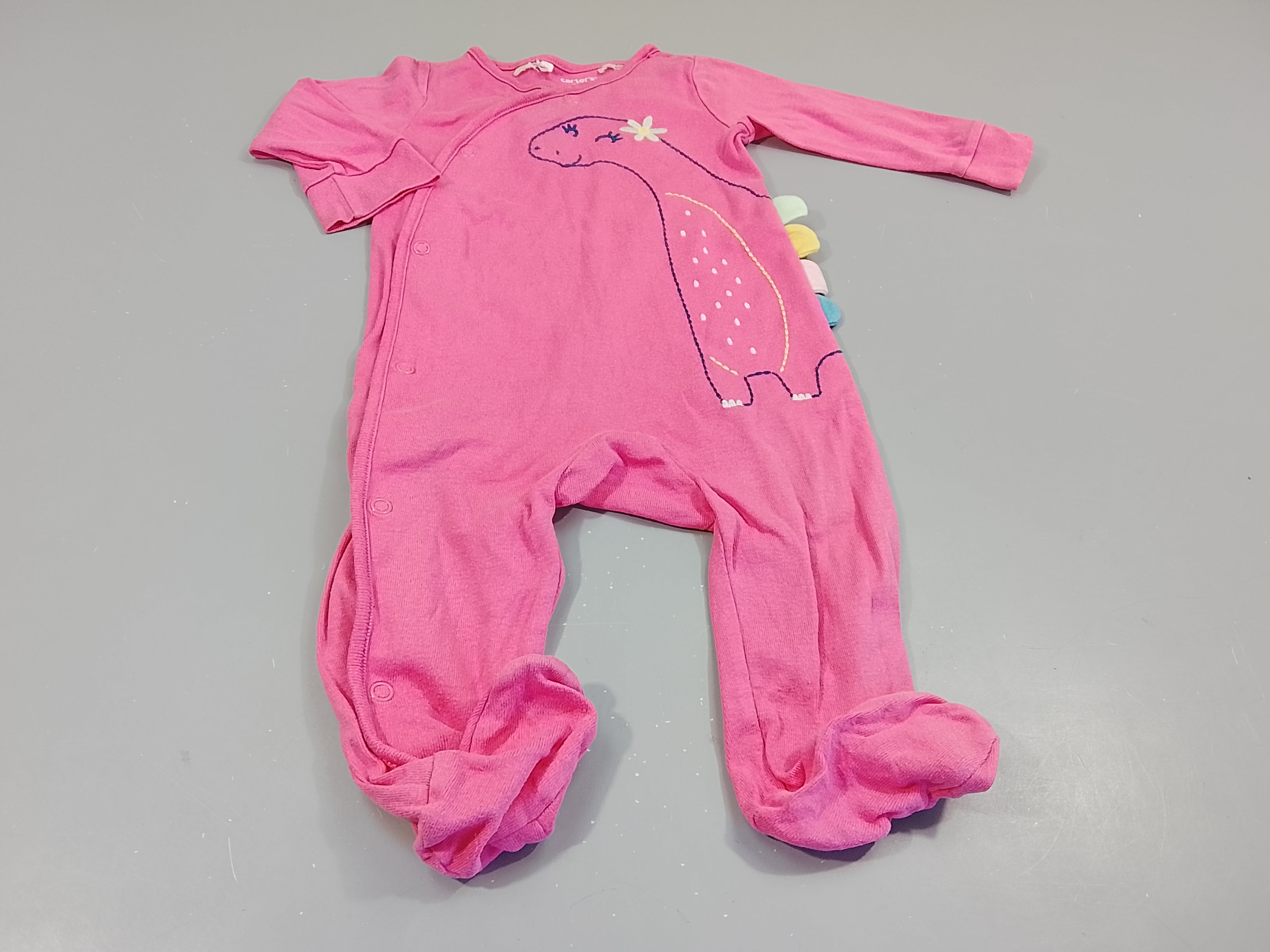 Pyjama jersey rose , dinosaure, légères taches bleues