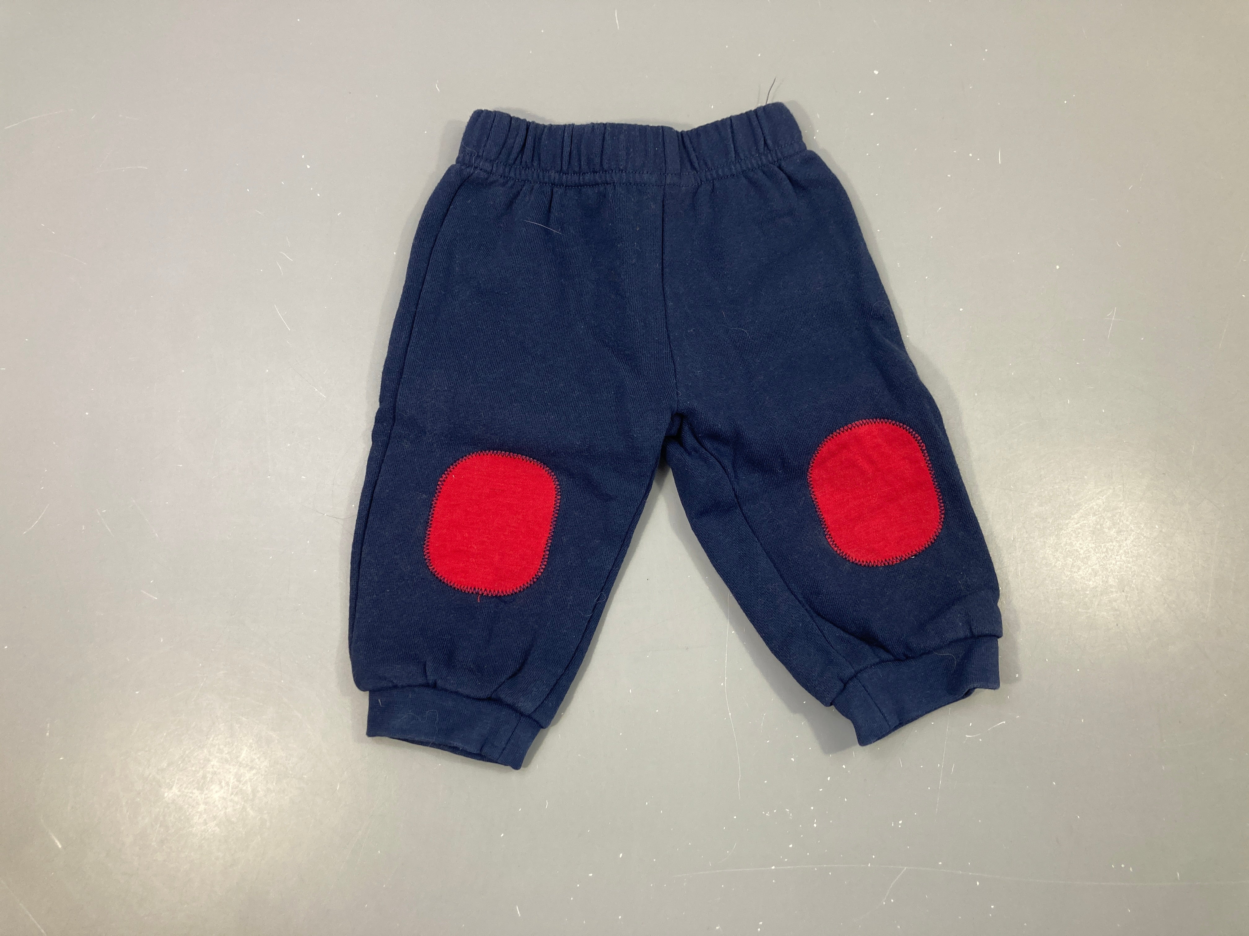 Pantalon de training bleu foncé  rouges genoux